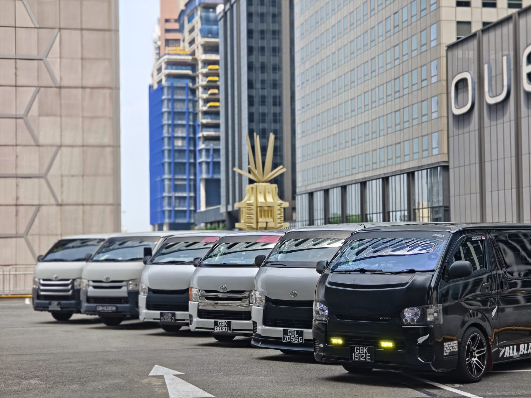 Six Yayo Service delivery vans in formation, from classic white liveries to a blacked-out TRD trim