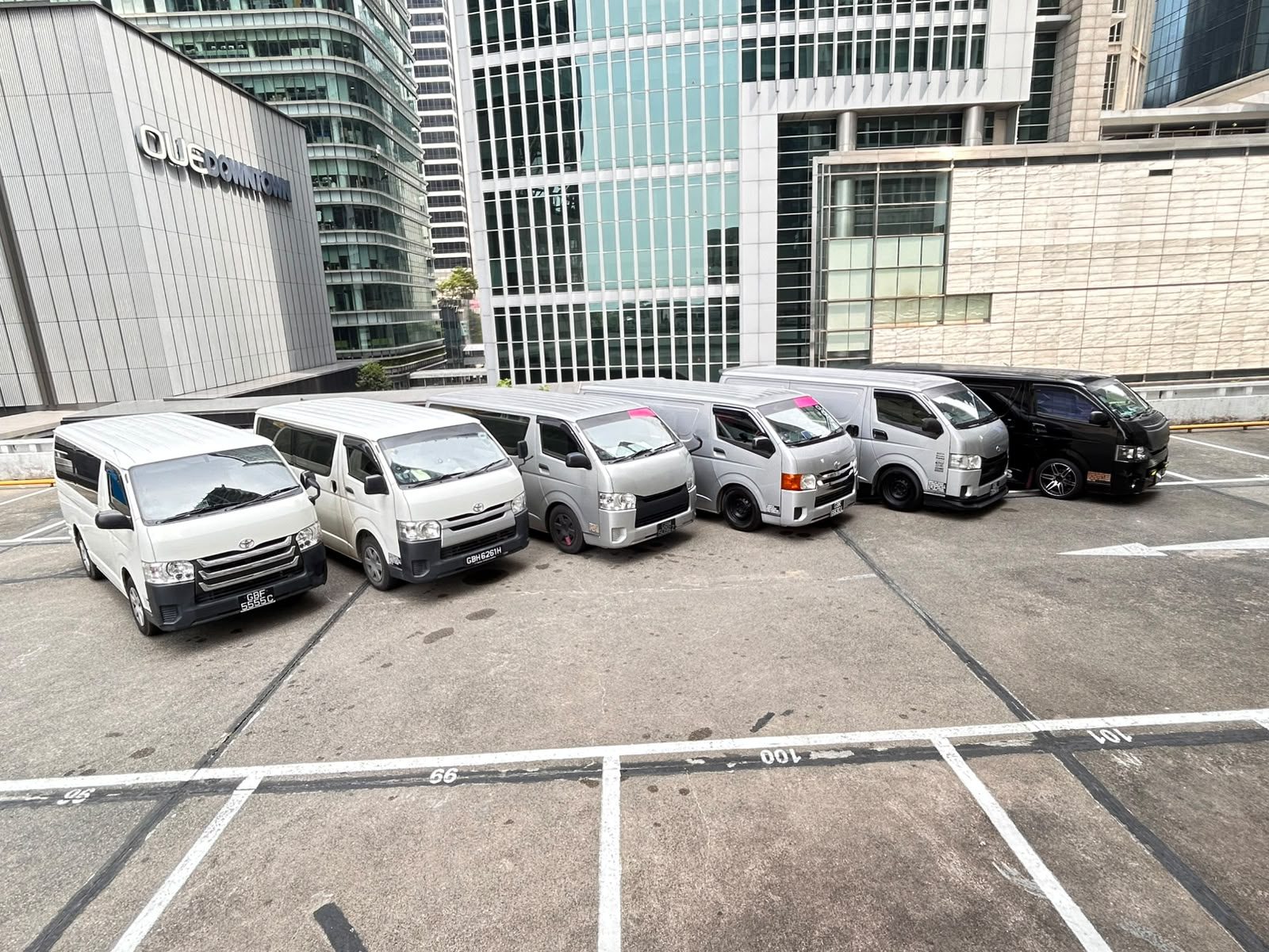Yayo Service Toyota Hiace delivery fleet lined up in Singapore's Central Business District, ready for the day's runs