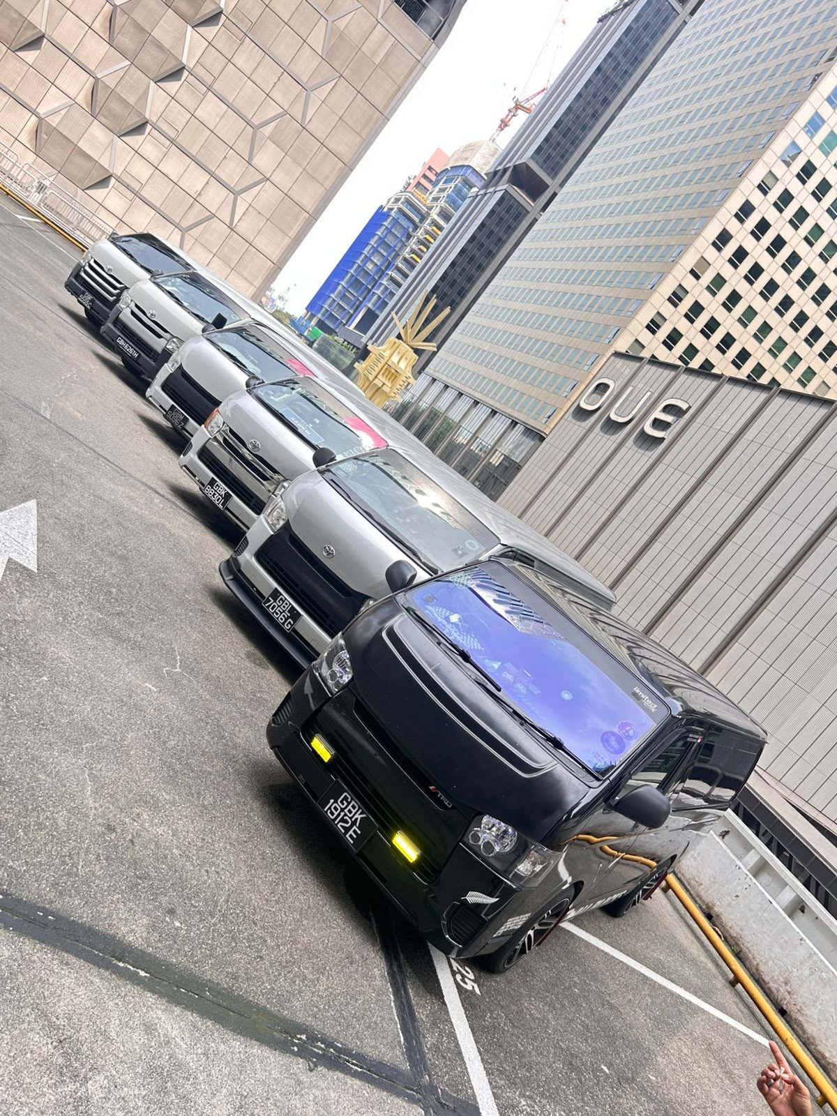 The Yayo Service delivery fleet parked in formation against the Singapore skyline